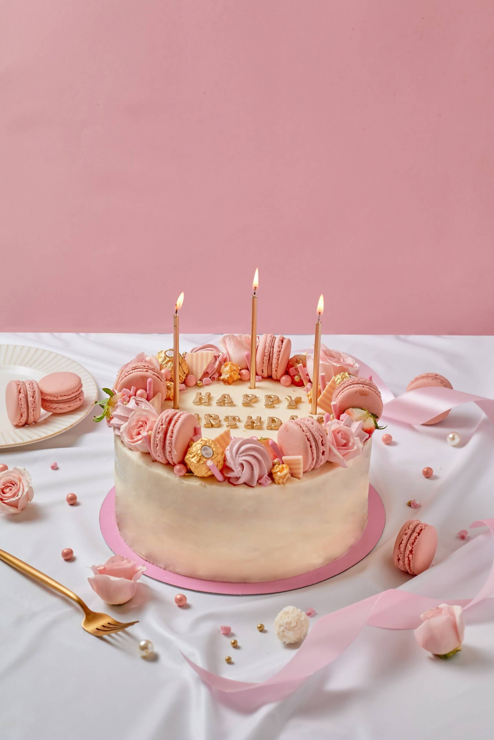 happy birthday cake pink with candles